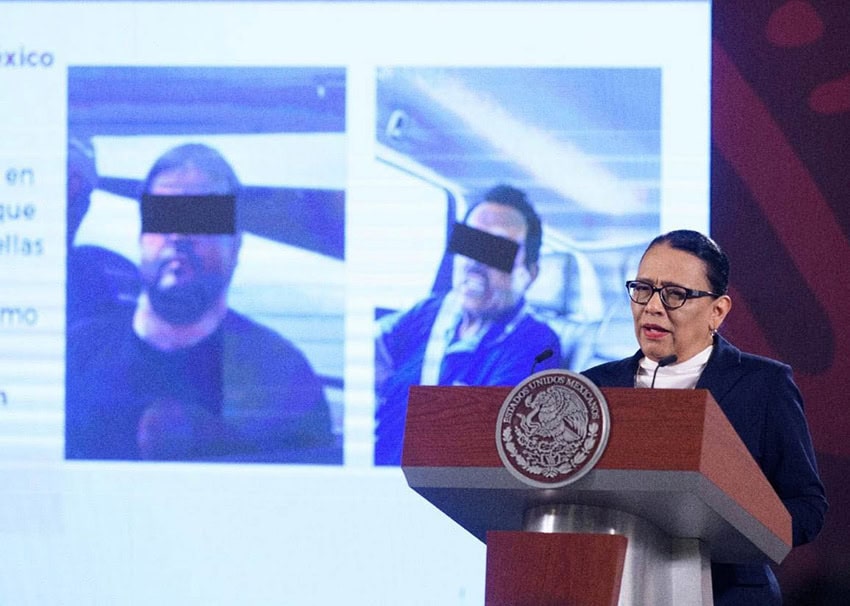 Security Minister Rosa Icela Rodríguez speaks at a podium with photos of El Mayo Zambada and Joaquín Guzmán López behind her.