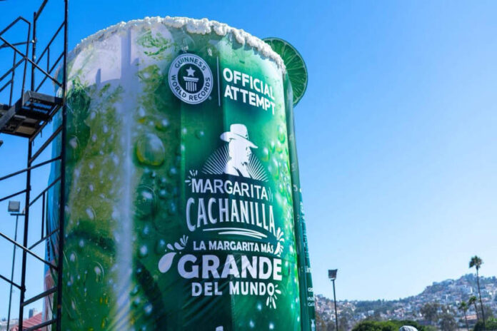 A massive 'Margarita Cachanilla' statue in Tijuana, Mexico. resembling an oversized cocktail cup, with the words 